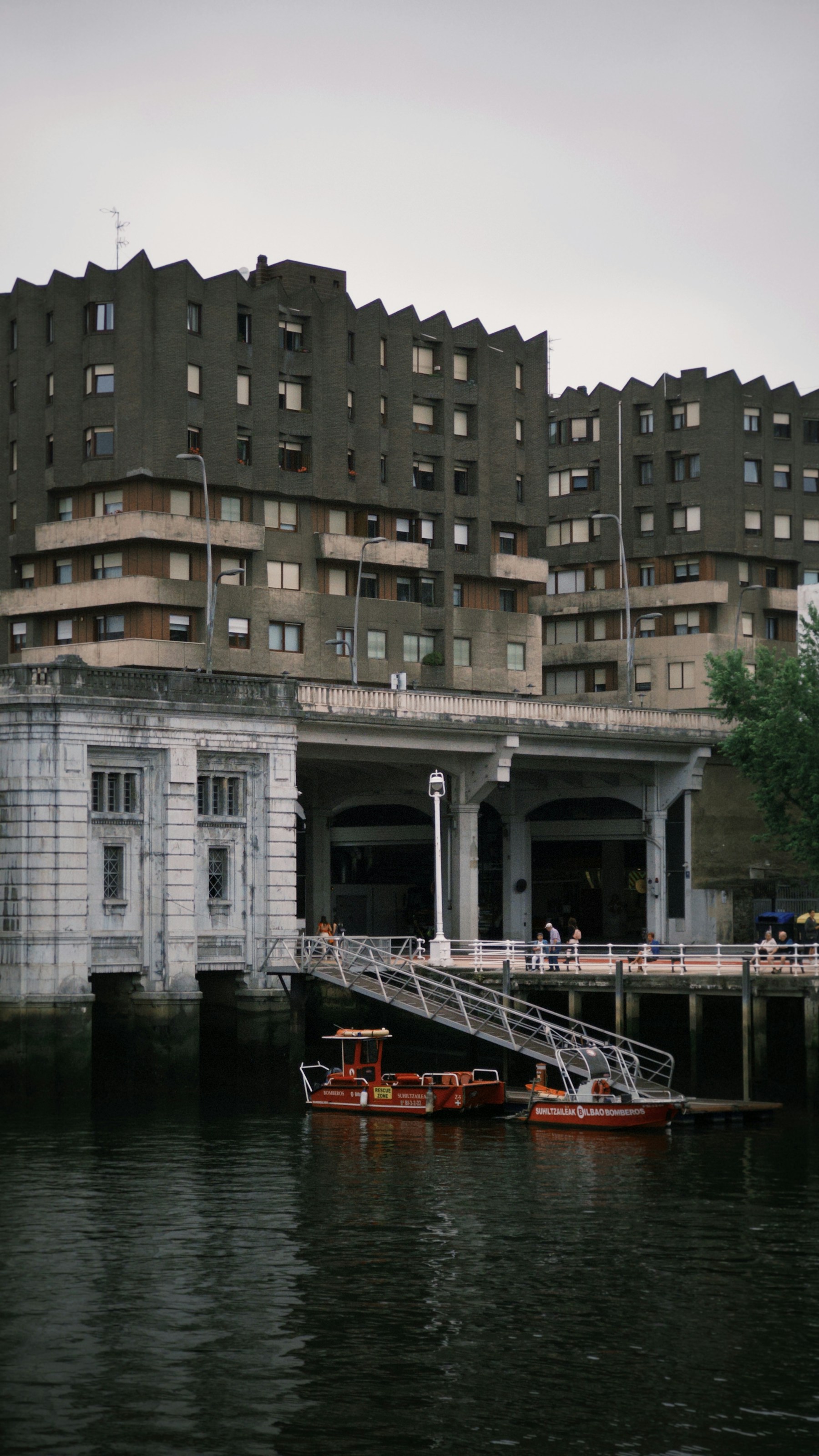 Buildings and boats along the Bilbao estuary